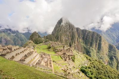 Aerial view of ruins of mountain against cloudy sky