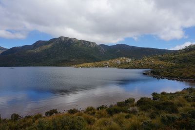 Scenic view of lake and mountains against sky