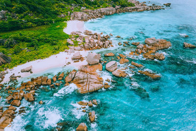 High angle view of rocks by sea