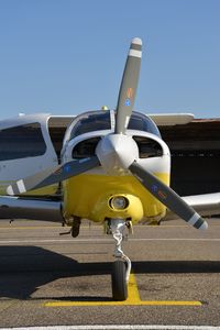 Airplane on airport runway against clear sky