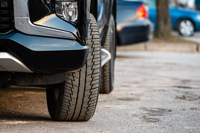 Close-up of car on street