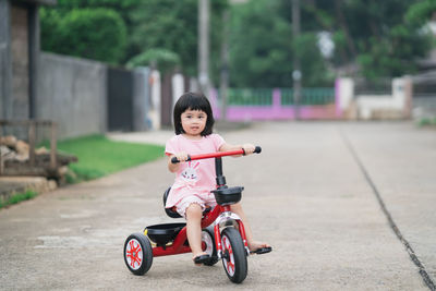 Portrait of cute girl riding motorcycle