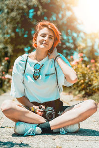 Young woman sitting outdoors