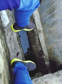 Low section of man standing on skateboard
