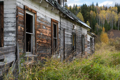 Exterior of old house on field