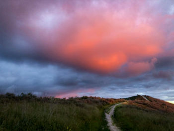 Scenic view of dramatic sky during sunset