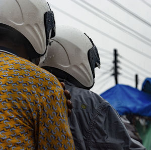 Portrait of person with umbrella in car during rainy season