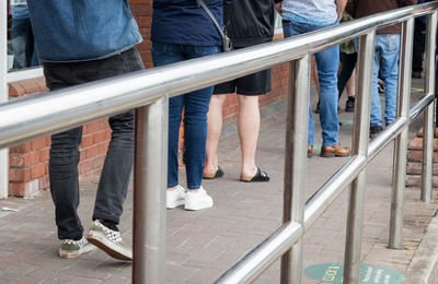 Low section of people standing on staircase