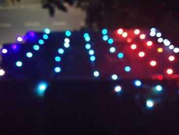Defocused image of illuminated lights at night