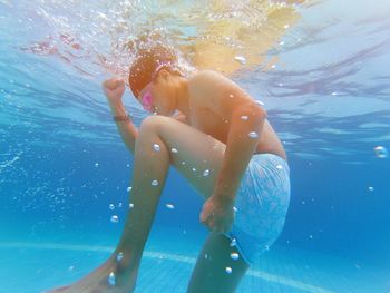 Young woman swimming in sea