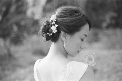 Portrait of woman with red flower