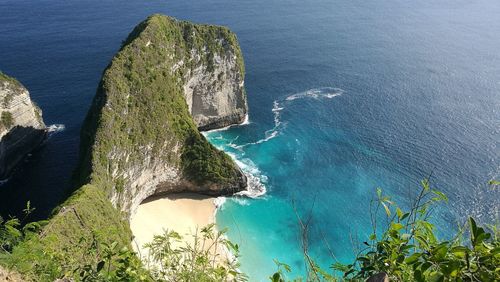 High angle view of rock by sea