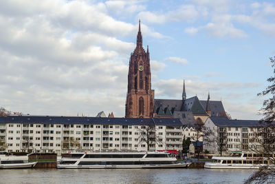 View of buildings against cloudy sky