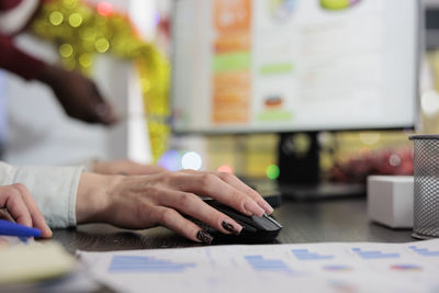 Midsection of man using laptop