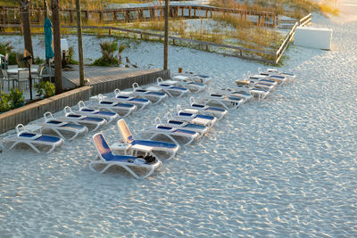 High angle view of lounge chairs at the beach