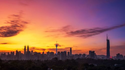 Cityscape against sky during sunset