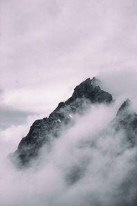 Scenic view of clouds covering mountain