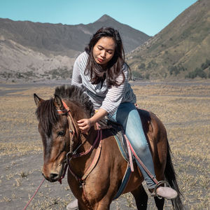 Woman riding horse