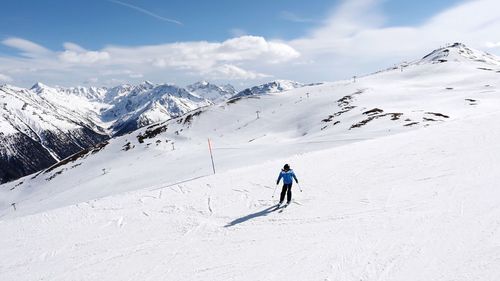 Person skiing on snowcapped mountain