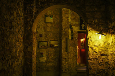 Illuminated entrance of old building