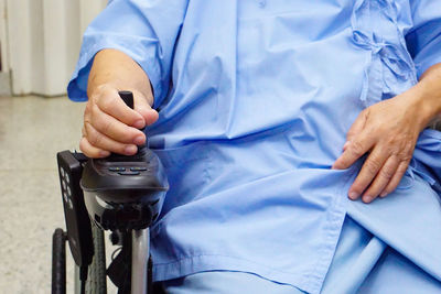 Midsection of man holding ice cream