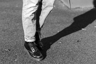 Low section of man standing on floor