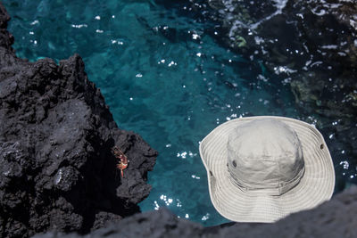 Close-up of hat in blue water
