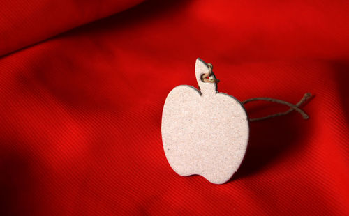 Apple shape decoration on red seat