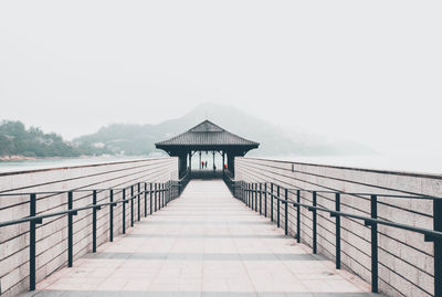 Gazebo by building against clear sky