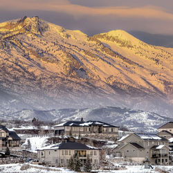 Scenic view of snow covered mountains against sky