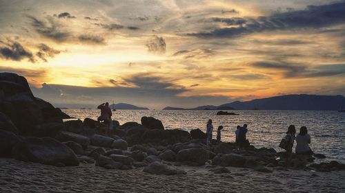 Scenic view of beach against sky during sunset