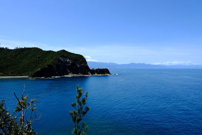 Scenic view of sea against clear blue sky