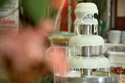 Close-up of water in glass bottle on table