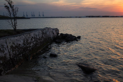 Scenic view of sea at sunset