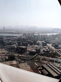 High angle view of buildings in city against sky