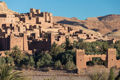 Buildings in city against clear sky