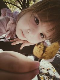 Close-up portrait of girl eating ice cream