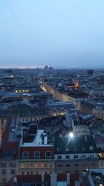 High angle view of illuminated cityscape against sky