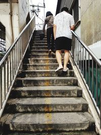 Low angle view of woman walking on staircase