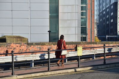 Full length of woman walking in city