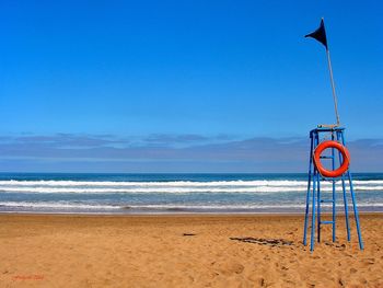 View of text on beach against sky