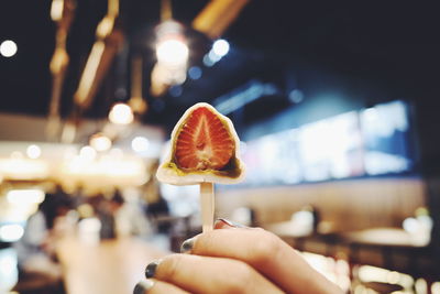 Close-up of hand holding ice cream