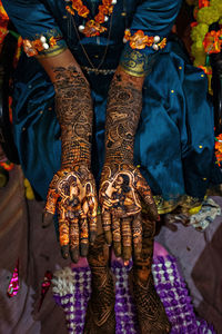 Low section of woman wearing traditional clothing