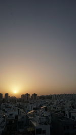 High angle view of buildings against sky during sunset