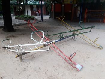 Bicycle parked by building in city