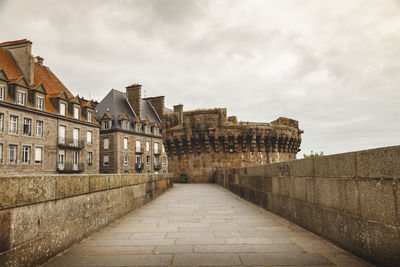 Granite walls surround the historic center of a medieval french town. saint malo of the corsairs