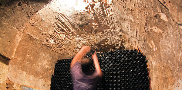 Blurred motion of man working at wine cellar