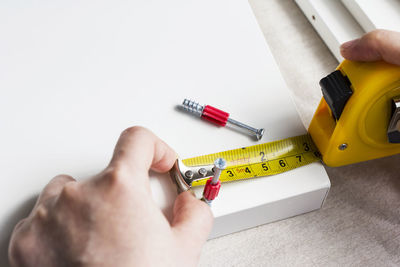 Close-up of hand holding paper