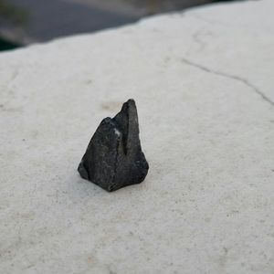 Close-up of black sand on beach