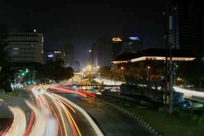 Light trails on city street at night